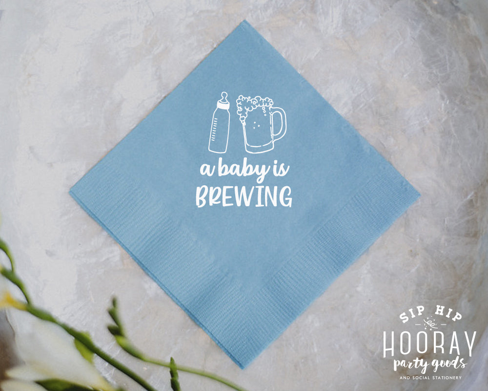 A Baby is Brewing Bottle and Beer Cheers Mug Cocktail Napkin